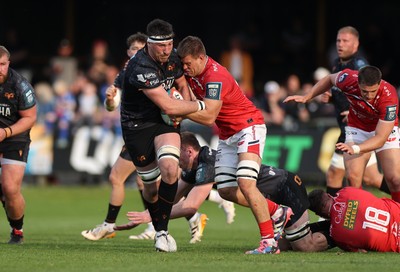 090526 - Ospreys v Scarlets - United Rugby Championship - Ryan Smith of Ospreys is tackled by Jarrod Taylor of Scarlets 