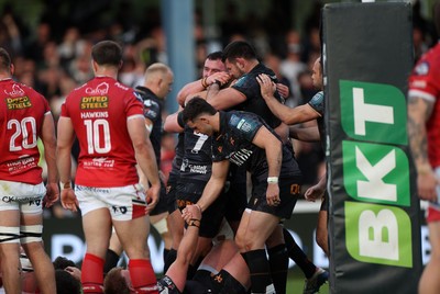 090526 - Ospreys v Scarlets - United Rugby Championship - Jac Morgan of Ospreys celebrates scoring a try with team mates