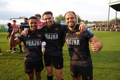 090526 - Ospreys v Scarlets - United Rugby Championship - Keelan Giles, Owen Watkin and Evardi Boshoff of Ospreys at full time