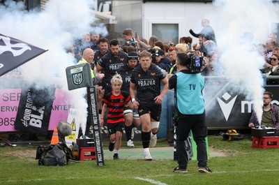 090526 - Ospreys v Scarlets - United Rugby Championship - Jac Morgan of Ospreys runs out with mascot