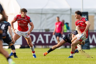 090526 - Ospreys v Scarlets - United Rugby Championship - Tom Rogers of Scarlets passes the ball to Eddie James of Scarlets
