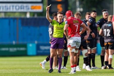 090526 - Ospreys v Scarlets - United Rugby Championship - Referee Ben Connor shows a yellow card as Joe Roberts of Scarlets is sent to the sin bin