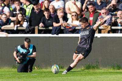 090526 - Ospreys v Scarlets - United Rugby Championship - Dan Edwards of Ospreys kicks at goal