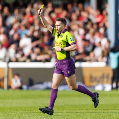 090526 - Ospreys v Scarlets - United Rugby Championship - Referee Ben Connor shows a yellow card