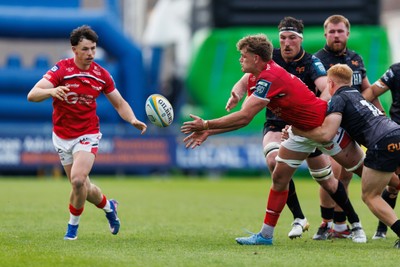 090526 - Ospreys v Scarlets - United Rugby Championship - Taine Plumtree of Scarlets passes the ball
