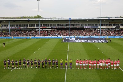 090526 - Ospreys v Scarlets - United Rugby Championship - Ospreys 'Our Blood is Black' banner before the match as players observe a minute's applause