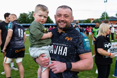 090526 - Ospreys v Scarlets - United Rugby Championship - Sam Parry of Ospreys and his son at the end of the match
