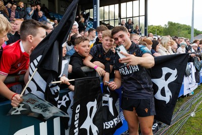 090526 - Ospreys v Scarlets - United Rugby Championship - Lewis Lloyd of Ospreys with fans at the end of the match