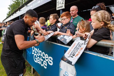 090526 - Ospreys v Scarlets - United Rugby Championship - Phil Cokanasiga of Ospreys with fans at the end of the match