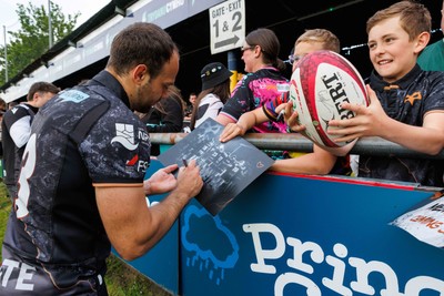 090526 - Ospreys v Scarlets - United Rugby Championship - Evade Boshoff of Ospreys with fans at the end of the match