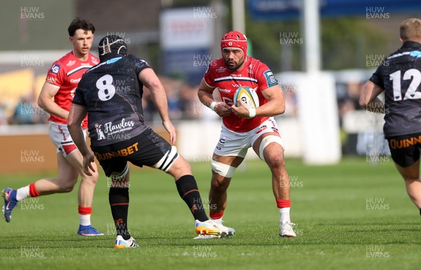 090526 - Ospreys v Scarlets - United Rugby Championship - Josh Macleod of Scarlets is challenged by Morgan Morris of Ospreys 