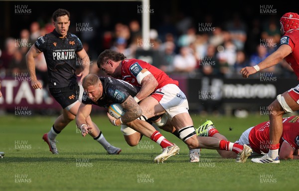090526 - Ospreys v Scarlets - United Rugby Championship - Ross Moriarty of Ospreys is tackled by Max Douglas of Scarlets 