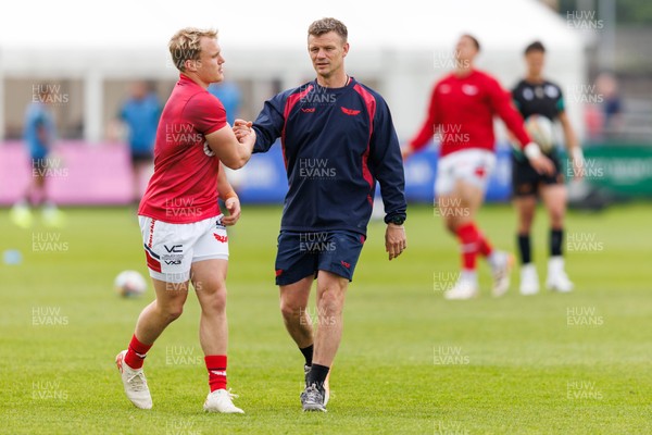 090526 - Ospreys v Scarlets - United Rugby Championship - Scarlets head coach Dwayne Peel with Blair Murray of Scarlets during the warm up