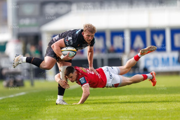 090526 - Ospreys v Scarlets - United Rugby Championship - Jac Morgan of Ospreys is tackled by Dane Blacker of Scarlets