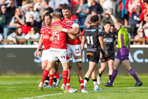 090526 - Ospreys v Scarlets - United Rugby Championship - Blair Murray of Scarlets celebrates with Max Douglas of Scarlets after scoring a try