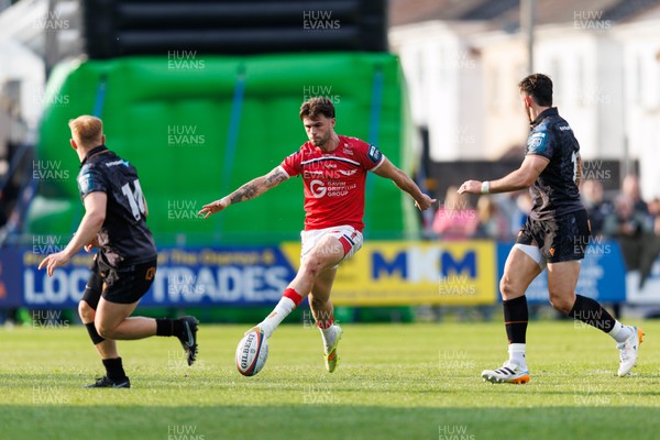 090526 - Ospreys v Scarlets - United Rugby Championship - Joe Roberts of Scarlets puts a grubber kick through