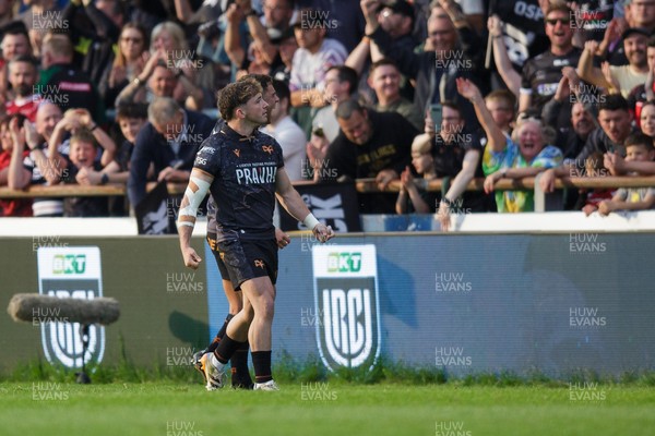 090526 - Ospreys v Scarlets - United Rugby Championship - Dan Edwards and Lewis Lloyd of Ospreys celebrate with fans at the end of the match