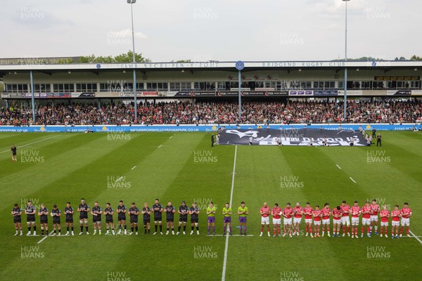 090526 - Ospreys v Scarlets - United Rugby Championship - Ospreys 'Our Blood is Black' banner before the match as players observe a minute's applause