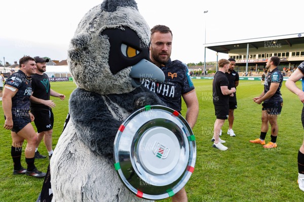 090526 - Ospreys v Scarlets - United Rugby Championship - Ospreys mascot and Morgan Morris of Ospreys with the Welsh Shield at the end of the match