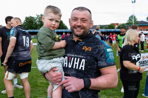 090526 - Ospreys v Scarlets - United Rugby Championship - Sam Parry of Ospreys and his son at the end of the match