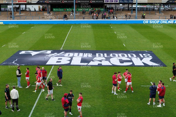 090526 - Ospreys v Scarlets - United Rugby Championship - Ospreys 'Our Blood is Black' banner at the end of the match