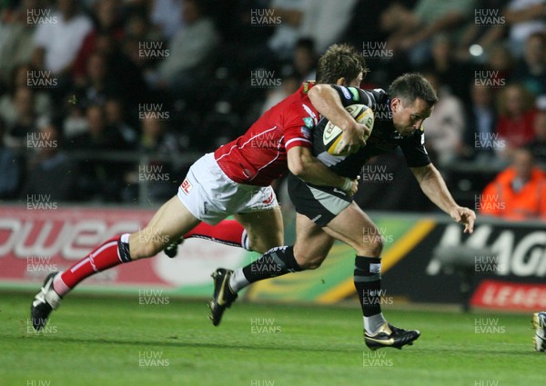 11.09.07 Ospreys v Scarlets... Ospreys Shaun Connor is tackled by Gavin Evans. 