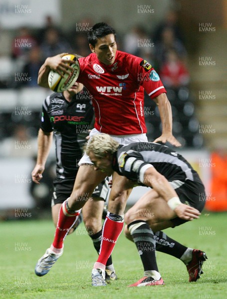 11.09.07 Ospreys v Scarlets... ScarletsRegan King is tackled by Justin Marshall 