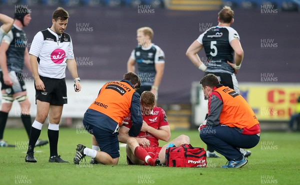 180519 - Ospreys v Scarlets - European Champions Cup Play off - Johnny McNicholl of Scarlets is seen to by medics but returns to play