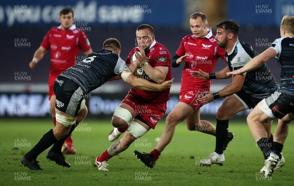 180519 - Ospreys v Scarlets - European Champions Cup Play off - Will Boyde of Scarlets is tackled by Olly Cracknell of Ospreys