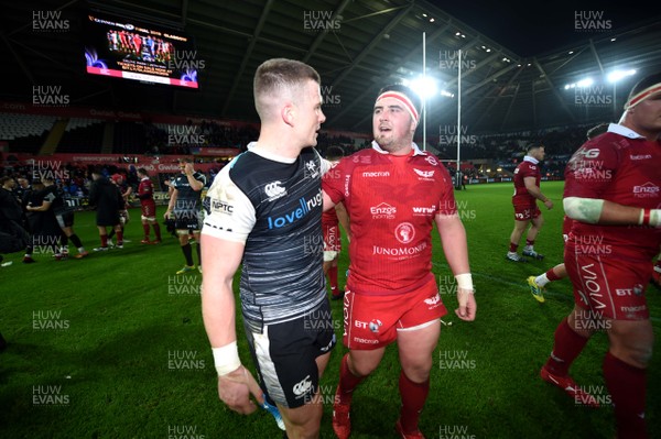221218 - Ospreys v Scarlets - Guinness PRO14 - Scott Williams of Ospreys and Wyn Jones of Scarlets at the end of the game