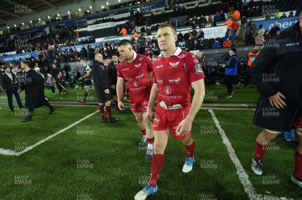221218 - Ospreys v Scarlets - Guinness PRO14 - Rob Evans of Scarlets and Hadleigh Parkes of Scarlets look dejected at the end of the game