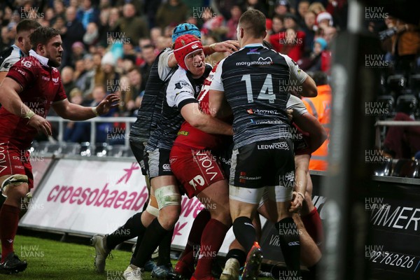 221218 - Ospreys v Scarlets - Guinness PRO14 - Ryan Elias of Scarlets is pushed into touch to end the game, which leads to a mass brawl between the teams