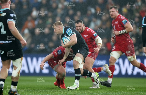 261123 - Ospreys v Scarlets - United Rugby Championship - Jac Morgan of Ospreys is tackled by Ryan Elias of Scarlets 