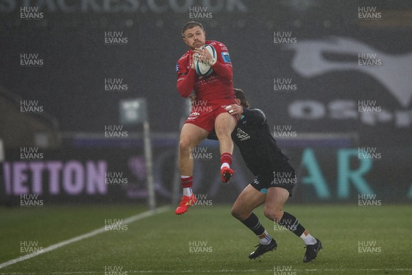 261123 - Ospreys v Scarlets - United Rugby Championship - Steff Evans of Scarlets takes a high ball