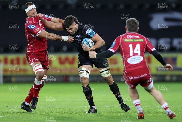 261222 - Ospreys v Scarlets - United Rugby Championship - Ethan Roots of Ospreys is tackled by Aaron Shingler of Scarlets