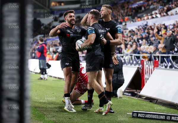 261222 - Ospreys v Scarlets - United Rugby Championship - Luke Morgan of Ospreys celebrates scoring a try with team mates