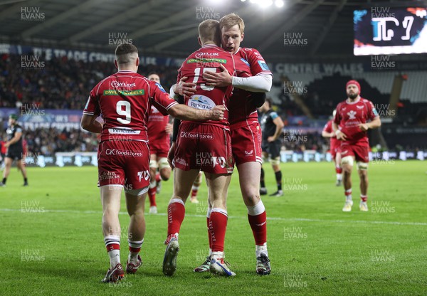 261222 - Ospreys v Scarlets - United Rugby Championship - Johnny McNicholl of Scarlets celebrates scoring a try with Rhys Patchell