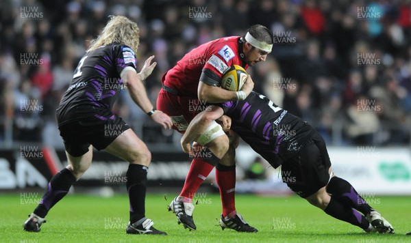 27.12.10 - Ospreys v Scarlets - Magners League - Josh Turnbull of Scarlets is tackled by Richard Hibbard of Ospreys. 