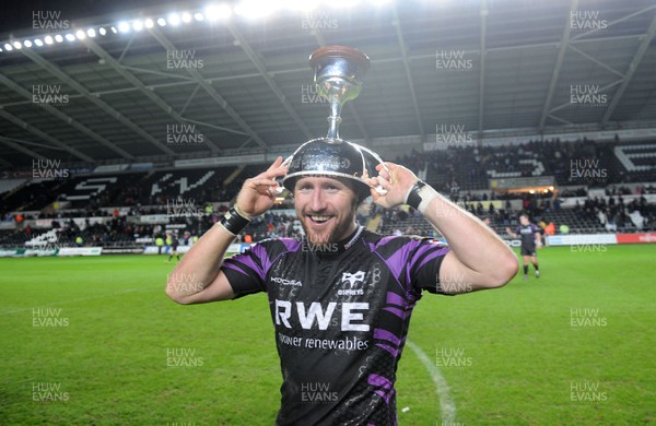 27.12.10 - Ospreys v Scarlets - Magners League - Barry Davies of Ospreys celebrates with the winners trophy 