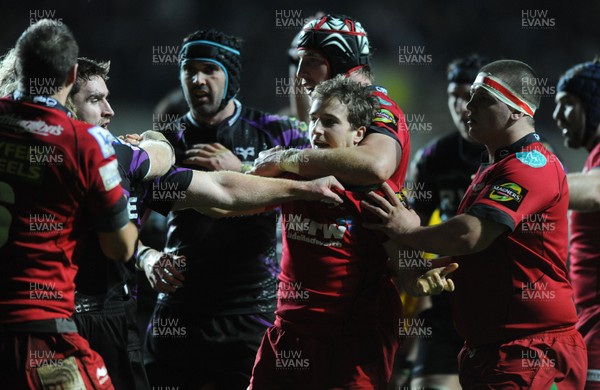 27.12.10 - Ospreys v Scarlets - Magners League - Martin Roberts of Scarlets is held back by Dominic Day. 