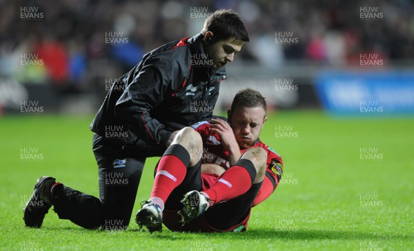 27.12.10 - Ospreys v Scarlets - Magners League - Morgan Stoddart of Scarlets is treated for an injury. 