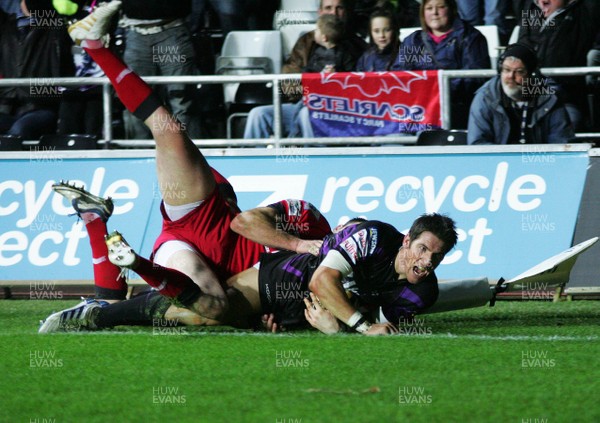 27.12.10 Ospreys v Scarlets - Magners League Ospreys' James Hook shows his delight as he crashes over in the corner to score. 