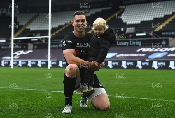 300422 - Ospreys v Scarlets - United Rugby Championship - George North of Ospreys with son Jac at the end of the game