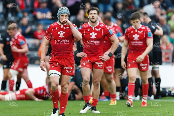 300422 - Ospreys v Scarlets - United Rugby Championship - Jonathan Davies of Scarlets looks dejected following an Ospreys try