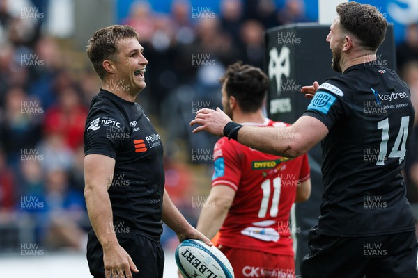 300422 - Ospreys v Scarlets - United Rugby Championship - Michael Collins of Ospreys celebrates scoring a try with Alex Cuthbert of Ospreys