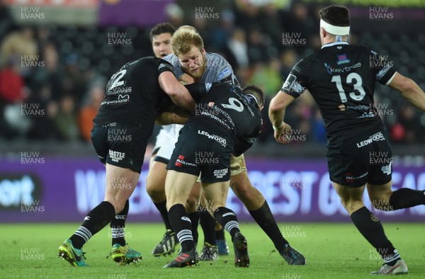 160218 - Ospreys v Southern Kings - Guinness PRO14 - Tienie Burger of Southern Kings is tackled by Sam Parry and Tom Habberfield of Ospreys
