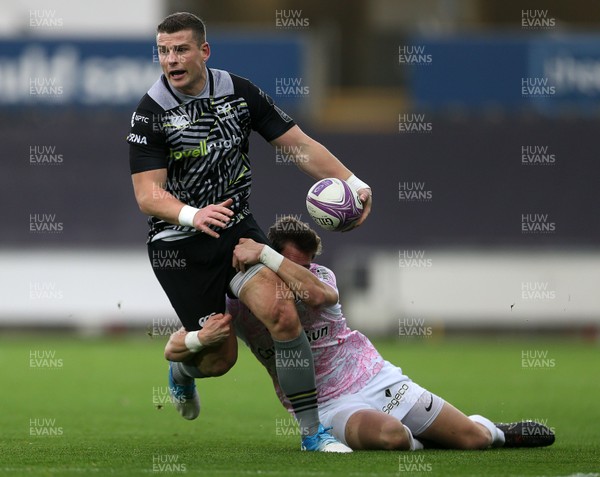 081218 - Ospreys v Stade Francais - European Challenge Cup - Scott Williams of Ospreys is tackled by Clement Daguin of Stade Francais