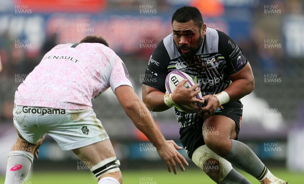 081218 - Ospreys v Stade Francais - European Challenge Cup - Ma'afu Fia of Ospreys is tackled by Hendre Stassen of Stade Francais