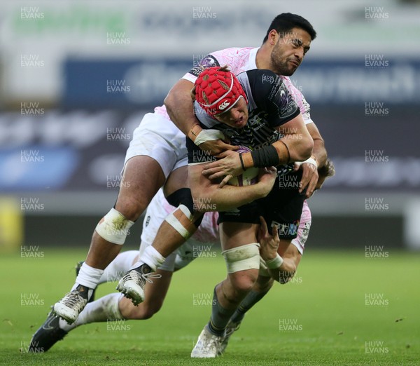 081218 - Ospreys v Stade Francais - European Challenge Cup - Sam Cross of Ospreys is tackled by Clement Daguin and Mailetoa Hingano of Stade Francais