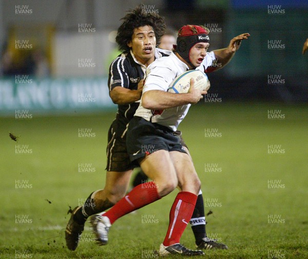 160104Neath Swansea Ospreys v Toulouse  Toulouses Vincent Clerk is tackled by Elvis Seveali'l  